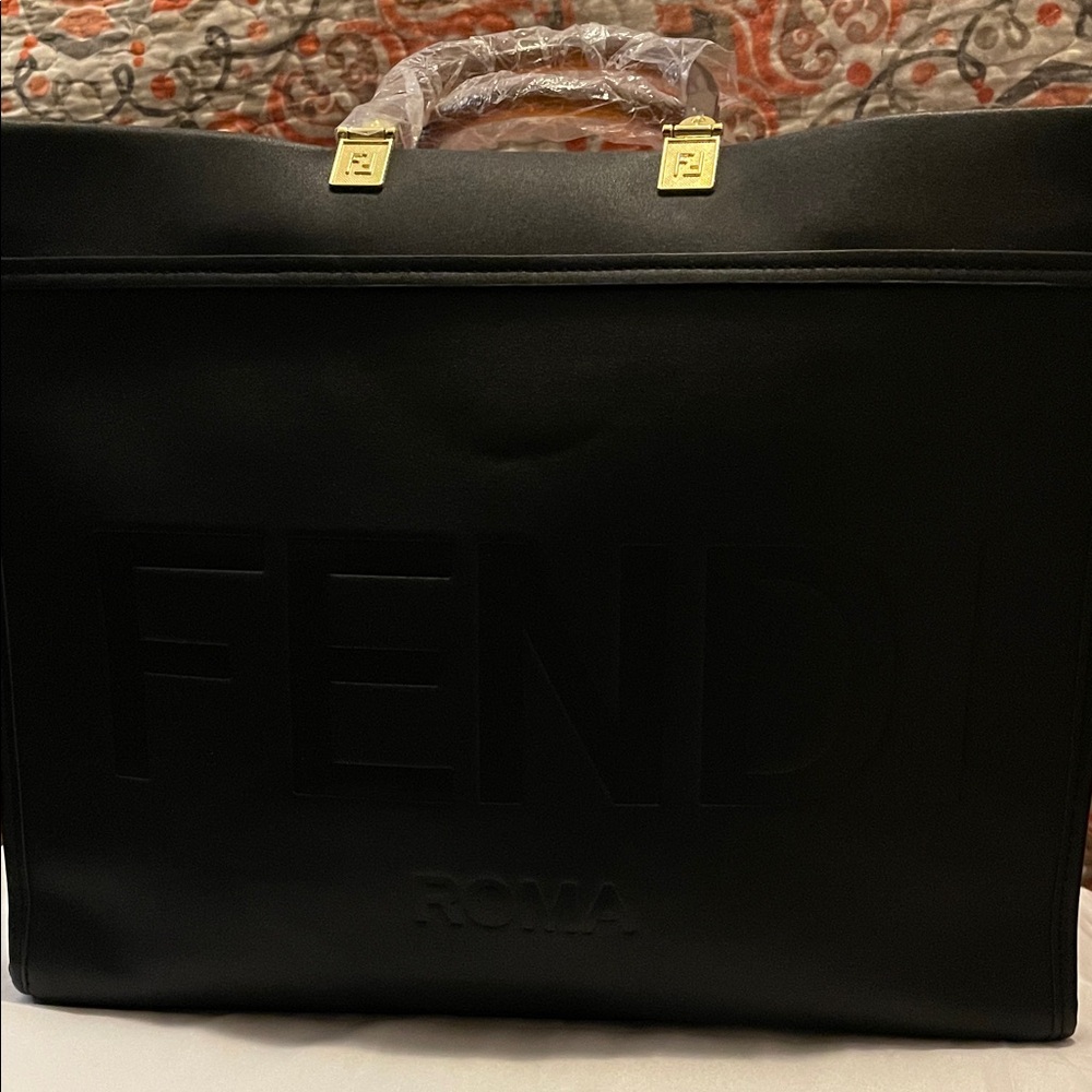 Beautiful Black Embossed Logo bag. Closet clearout no returns. As is bag only.